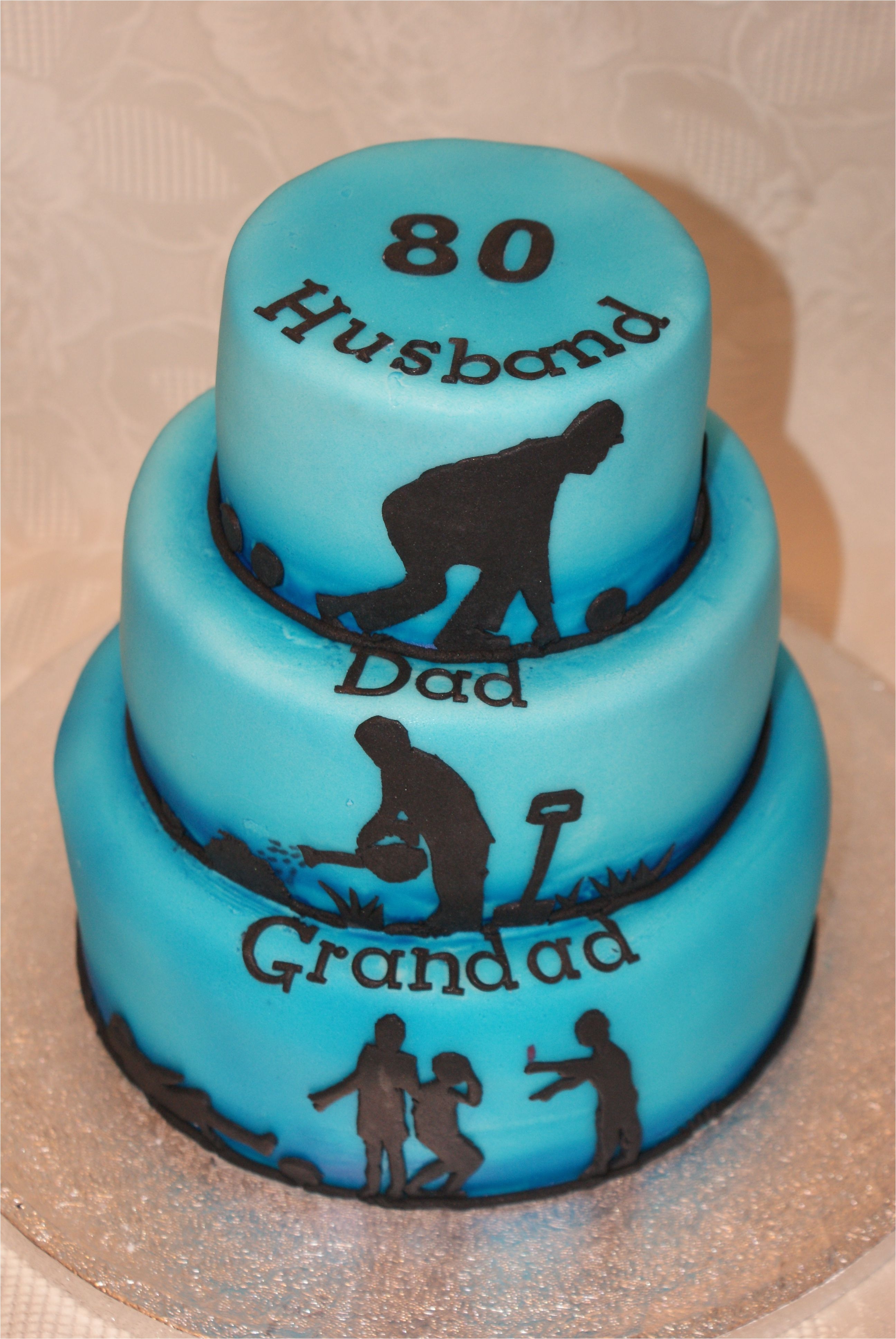 80th birthday cake husband dad grandad tiered cake with lawn bowls gardening and football silhouettes