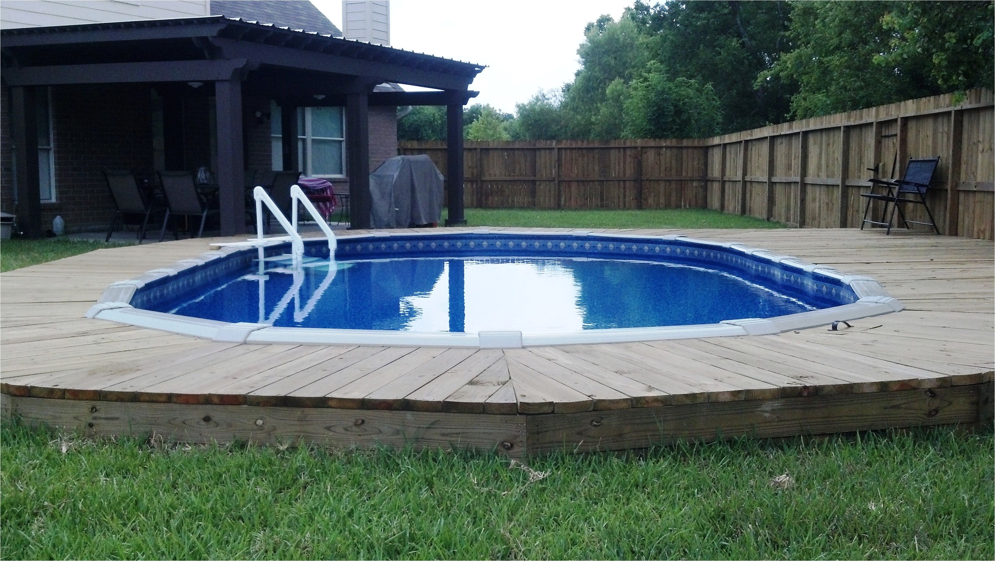 countersunk above ground pool with deck gives the feel of an inground pool for a fraction of the cost love it