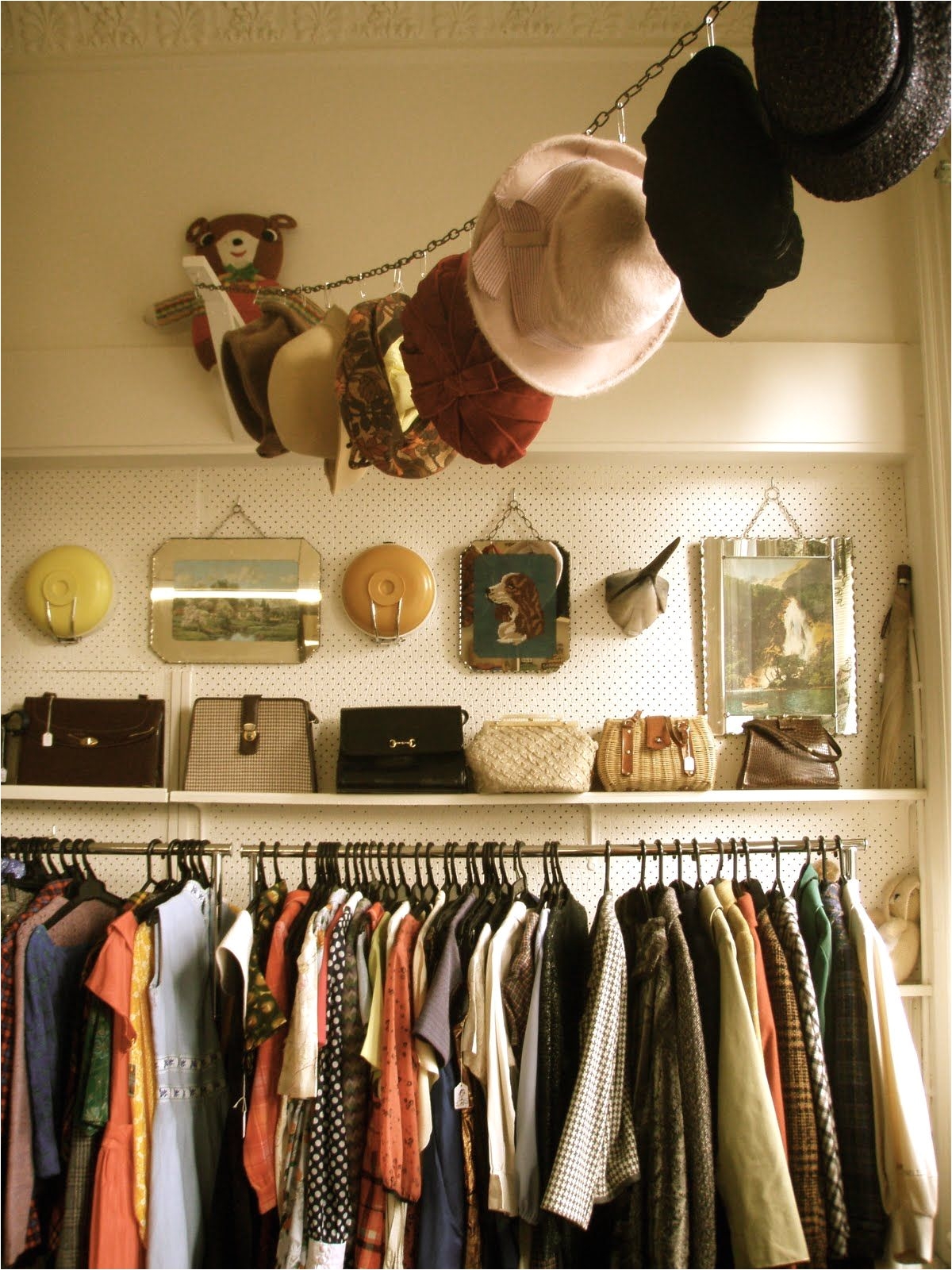 hat storage idea clothes pins s hooks or curtain hangers decorated top shelf area of the closet with purses extras