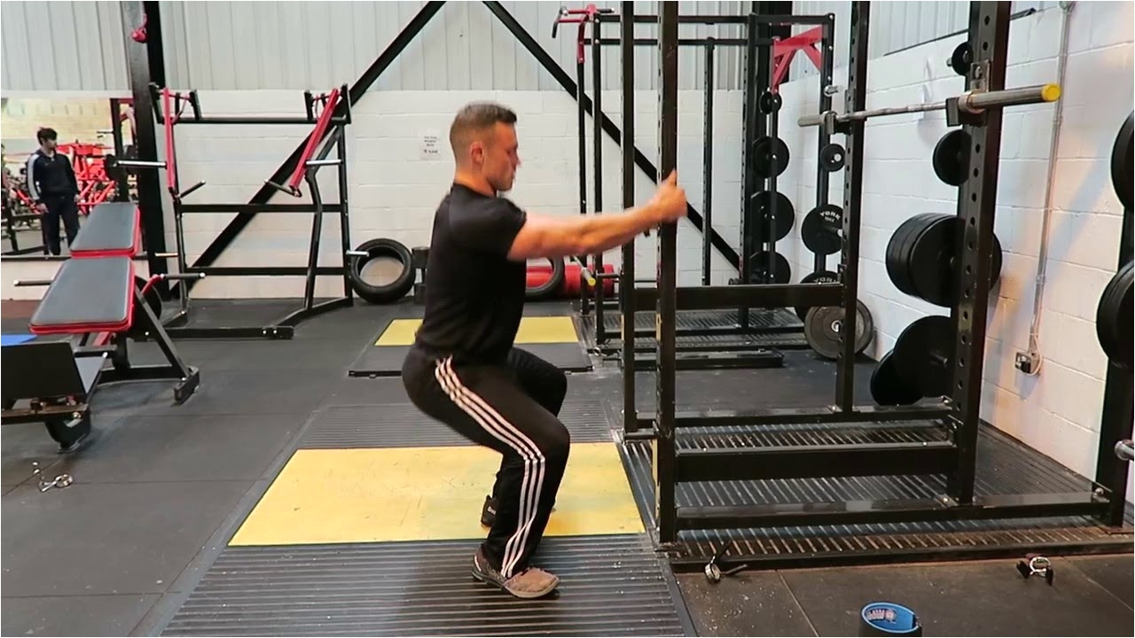 squat rack assisted counterweight squat optimum performance