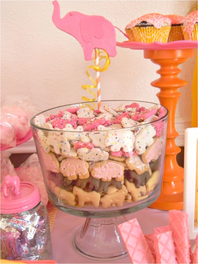 a circus cookie party table display for an elephant baby girl shower