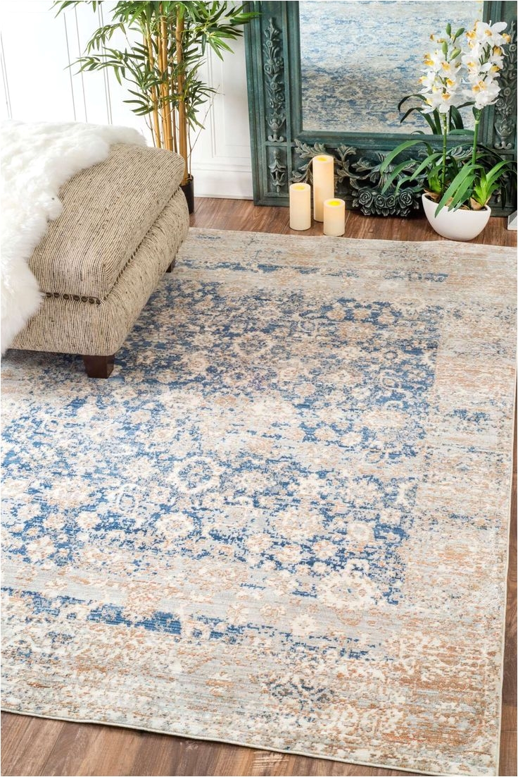 the colors in this rug are blue beige and tan
