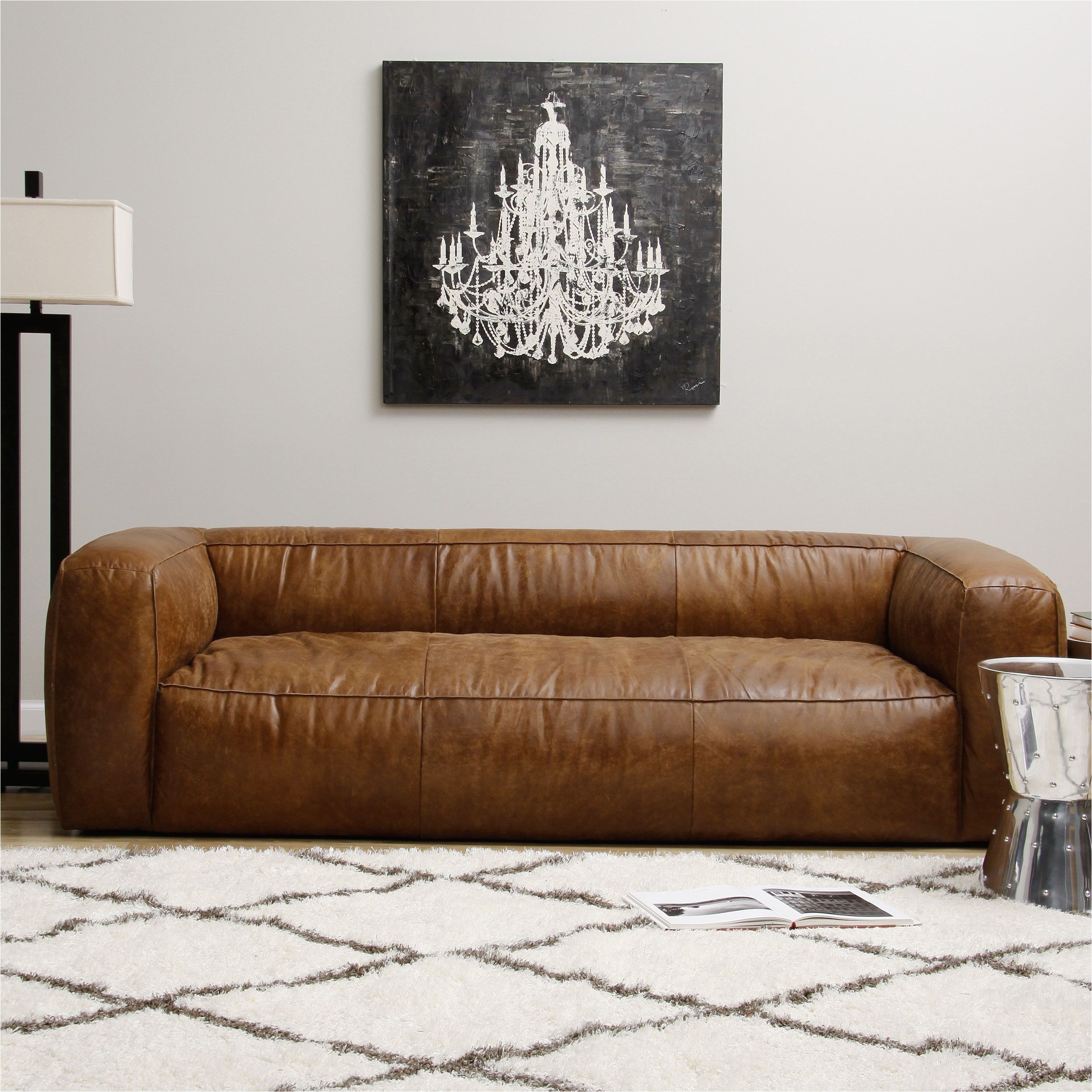 this puffy contemporary sofa is composed of full italian leather with a lovely distressed finish the comfortable piece contains a soft assortment of