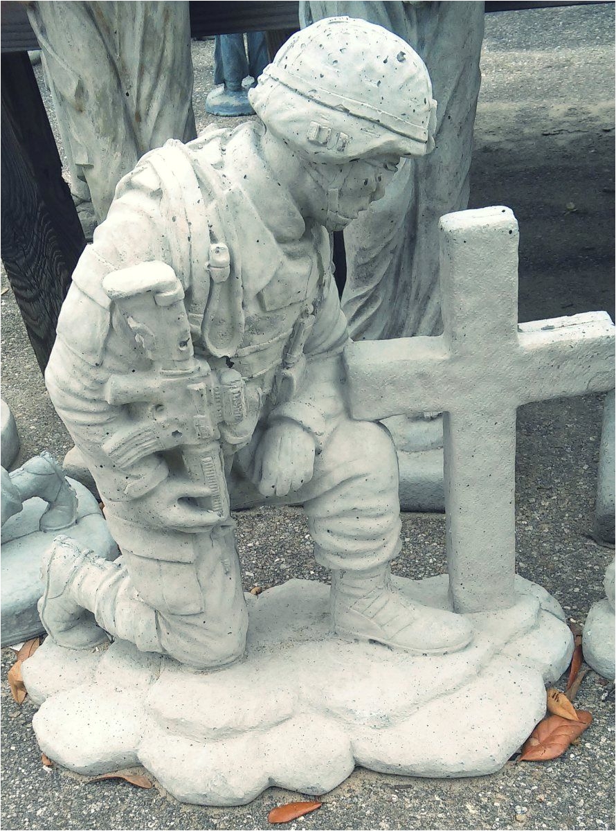 soldier kneeling at cross concrete garden art in tallahassee florida