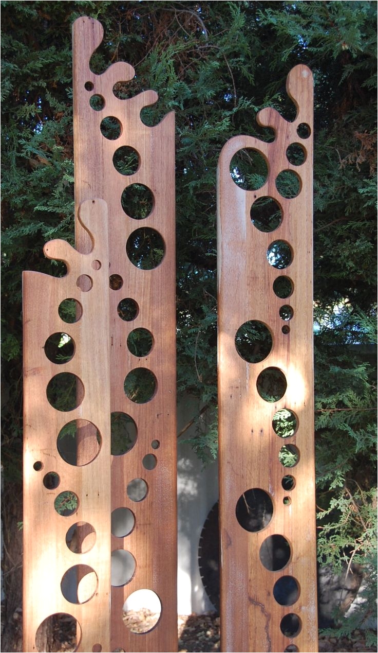 decorative holes totems a garden sculpture