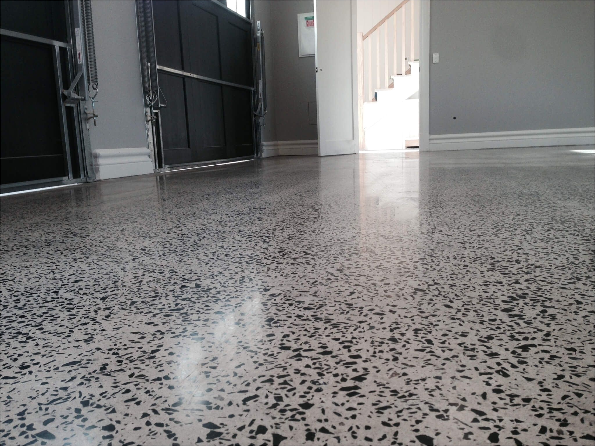 garage floor coatings like epoxy paint or concrete stain or coverings like snap together tiles or floor mats instantly improve your garage