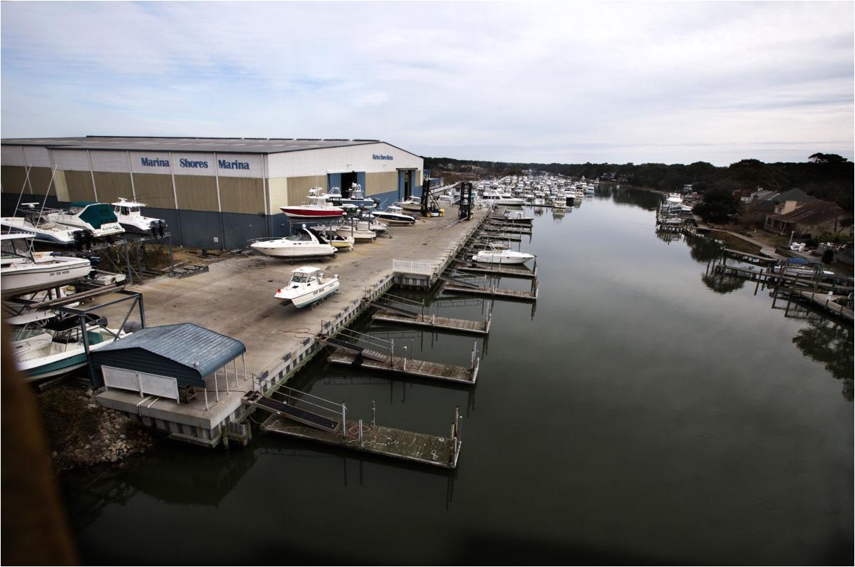 waterfront luxury apartments and restaurant would replace part of virginia beach marina built in 1980s