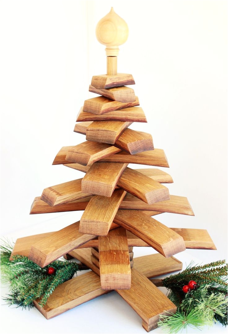 this hand made christmas tree is a beautiful addition to any home it is made from reclaimed napa valley wine barrel staves there are 15 staves hand cut to