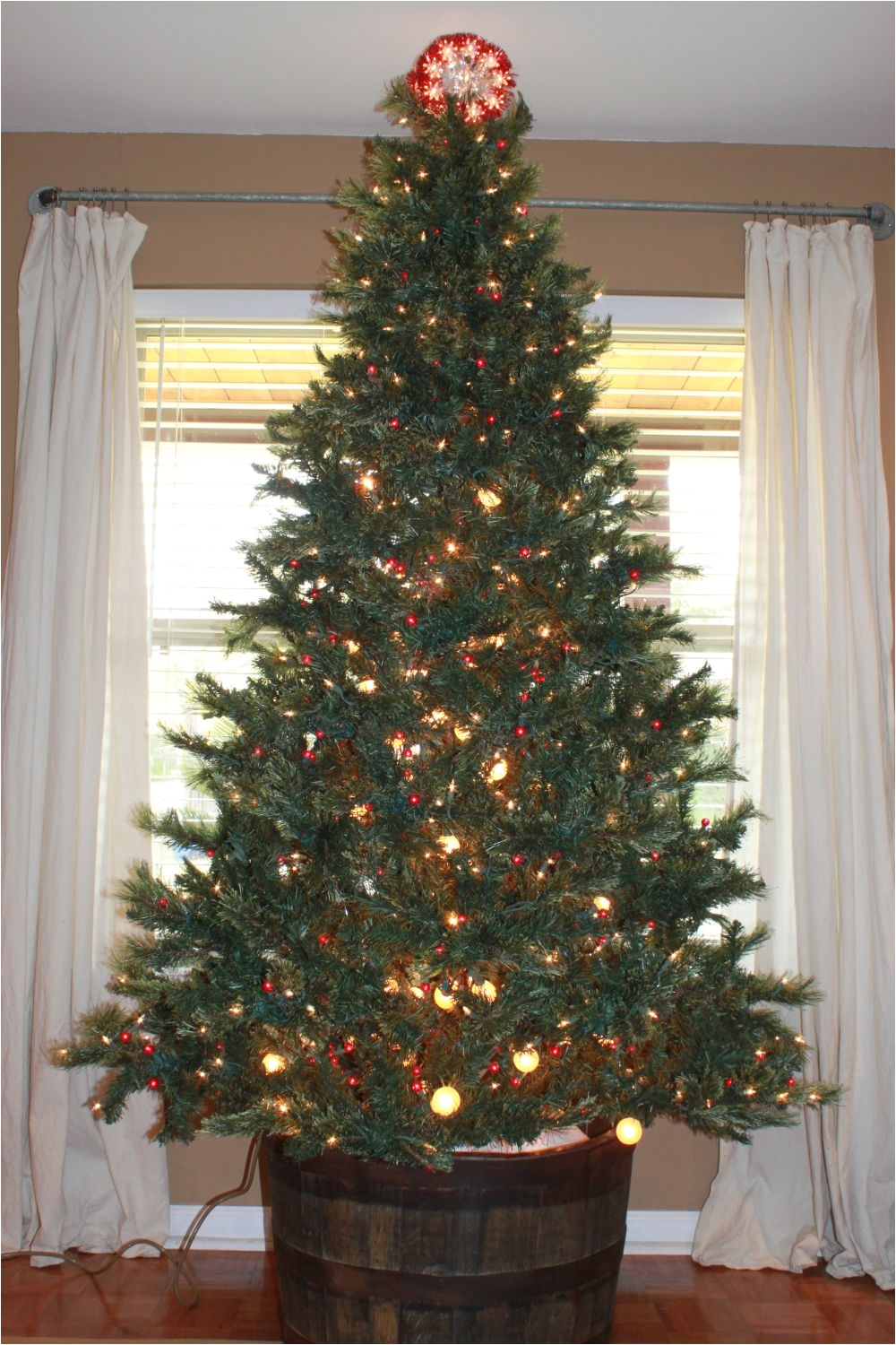 putting the christmas tree in a whiskey barrel cute idea now the cat won t destroy the tree skirt