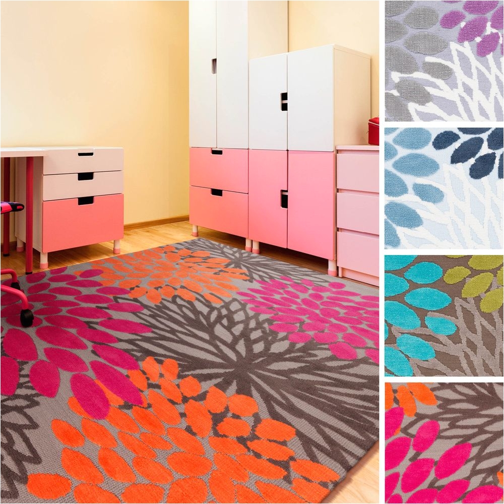 add a playful accessory to your child s bedroom with this polyester area rug featuring bright