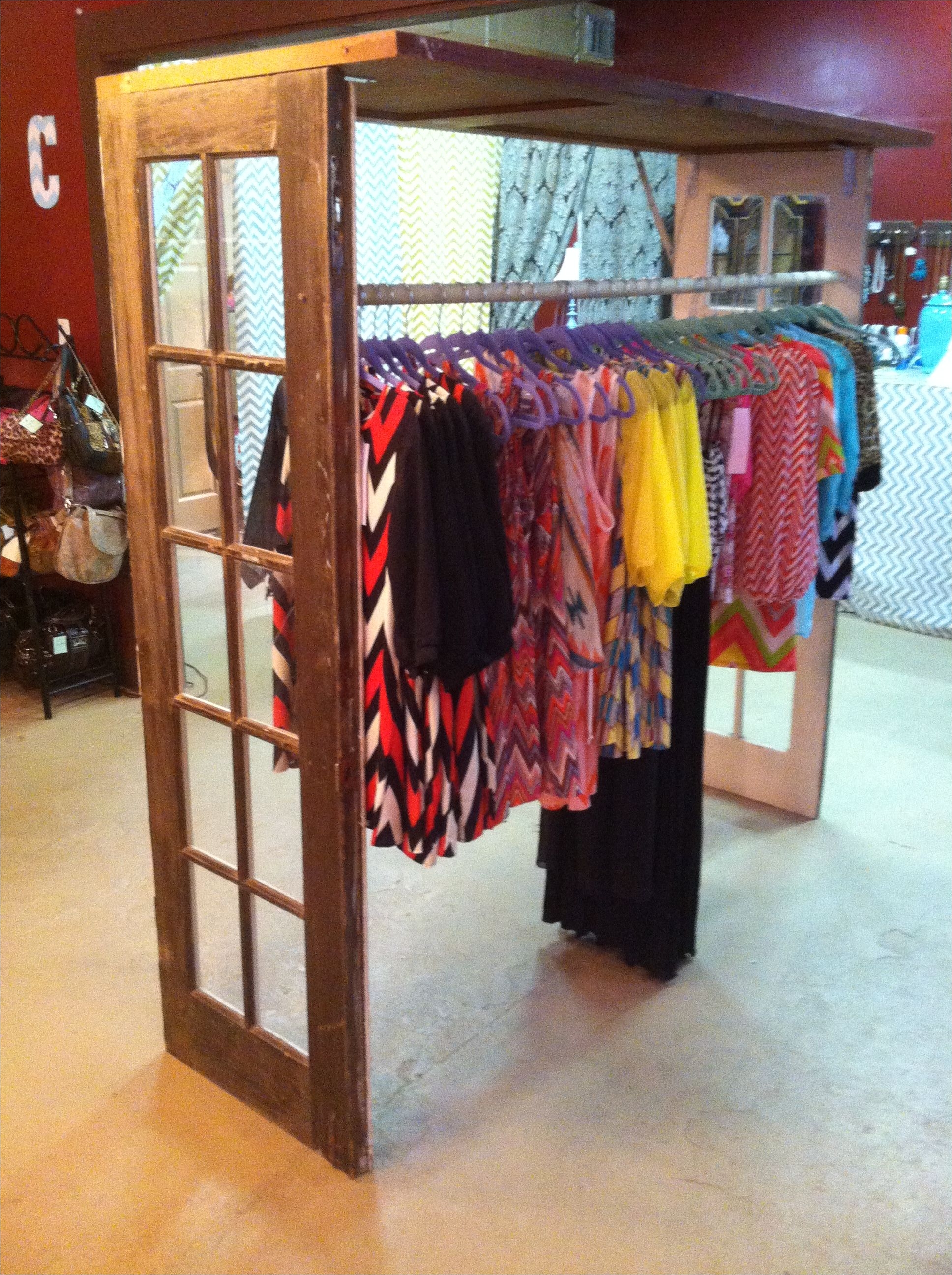 boutique clothing rack made of 3 vintage doors and a pole from lowes my husband made this for me last night huge and i love it