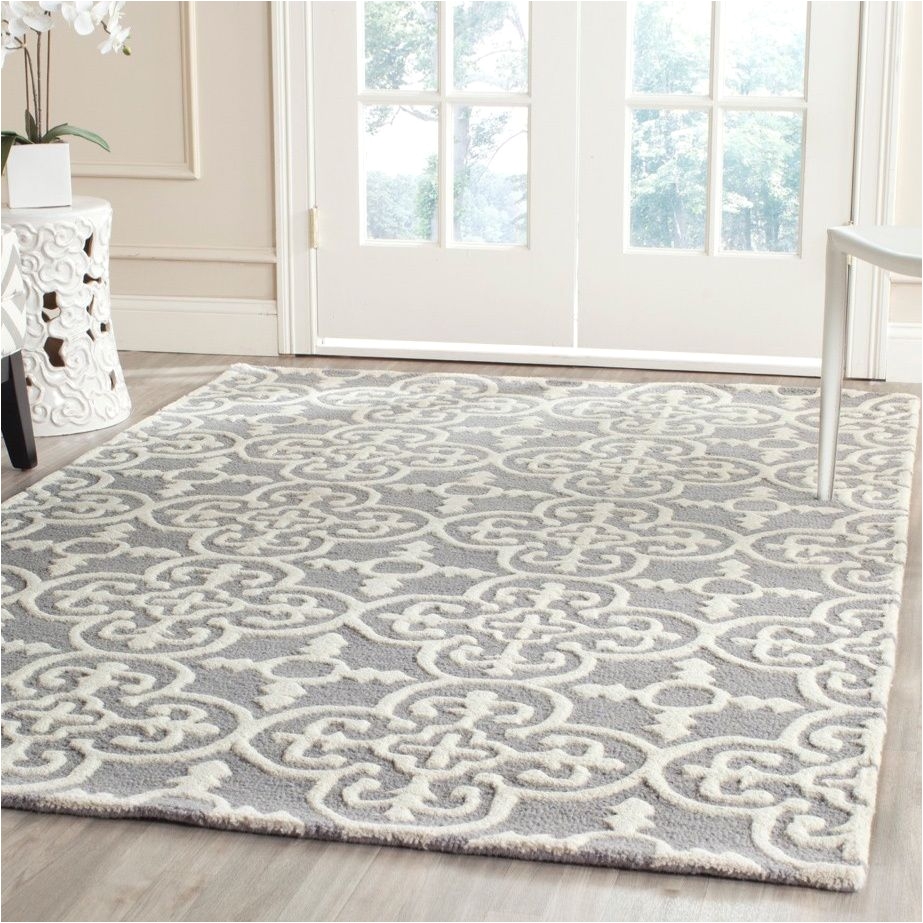 hand tufted of a 100 percent wool pile this handmade wool rug features a special high low construction to add depth and unusual detailing