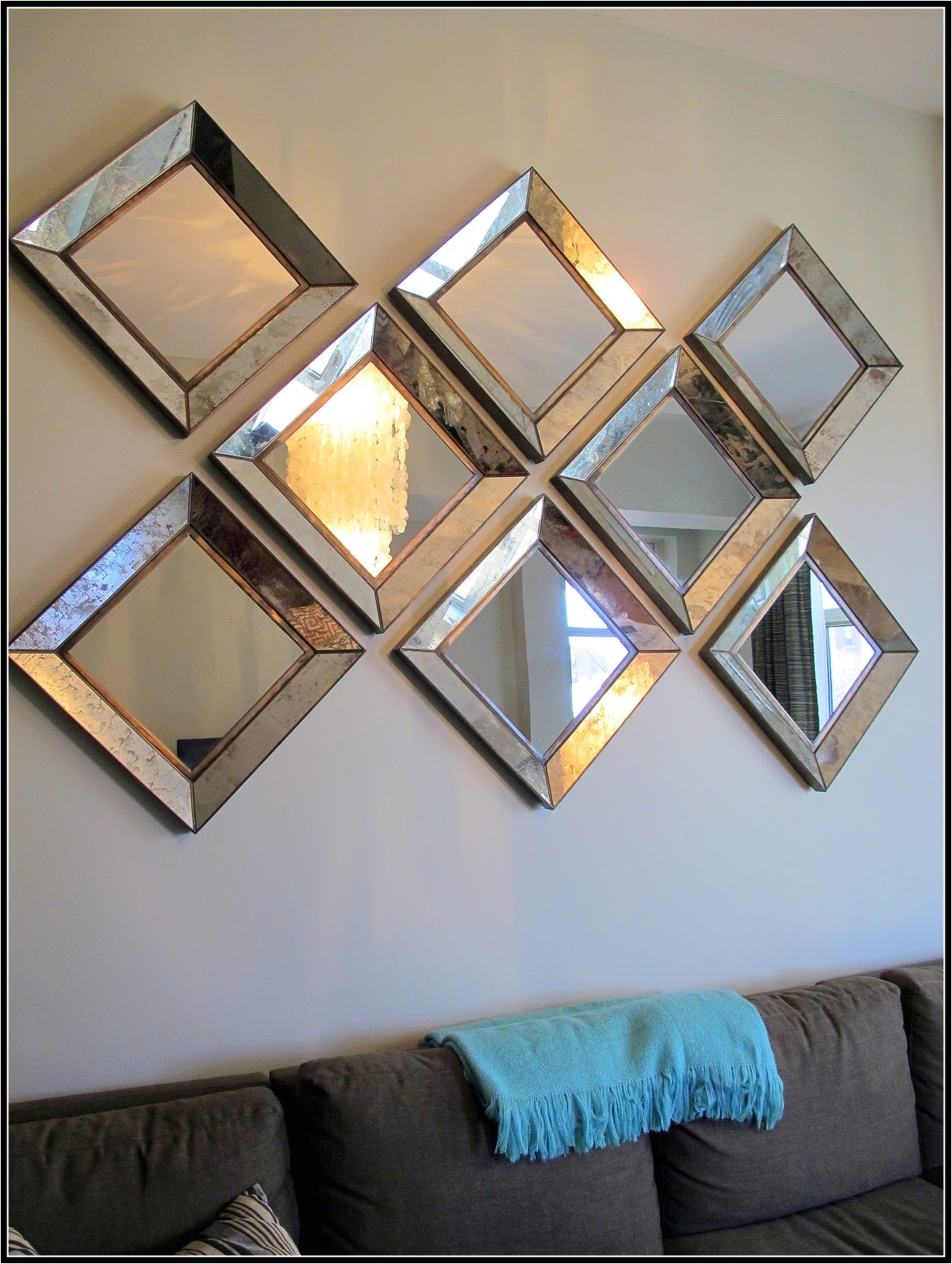 luckily three years later crate barrel still sells the dubois mirrors so we were able to purchase four more and create a diagonal diamond shape that not