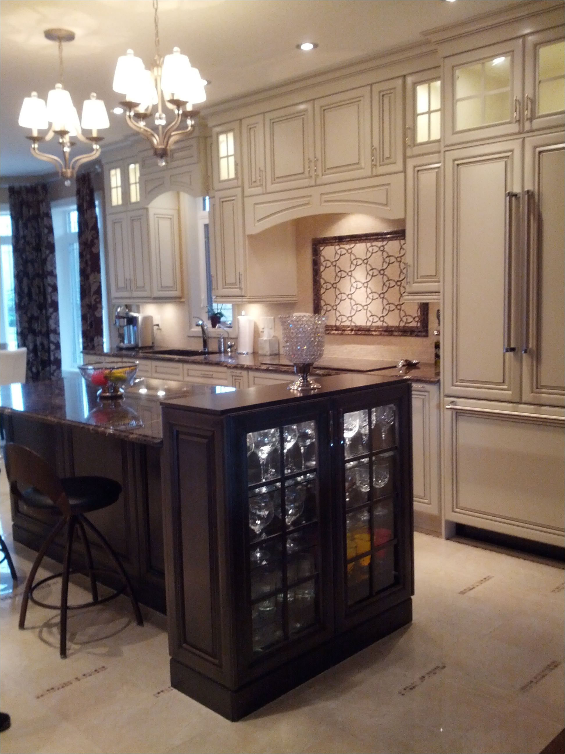cabinetry kitchen craft color seashell w smoke glaze island weathered slate species maple back view of island