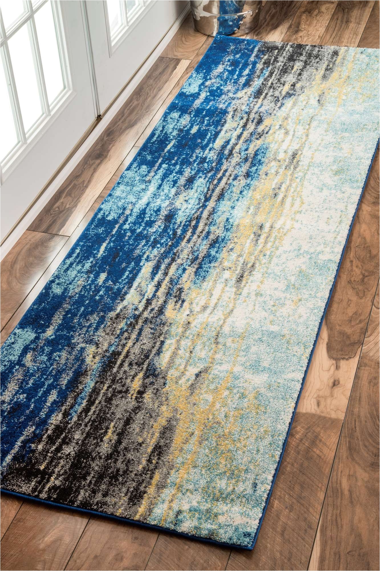 bring in the marine theme and a beautiful vintage charm to your home with this 100 percent polypropylene machine woven abstract waterfall rug