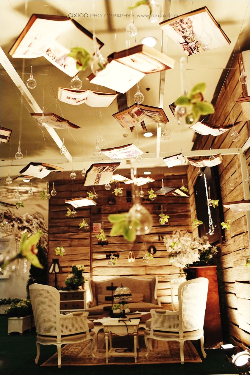 hanging books installation fantasy magical decor bookcases to divide the reception and ceremony