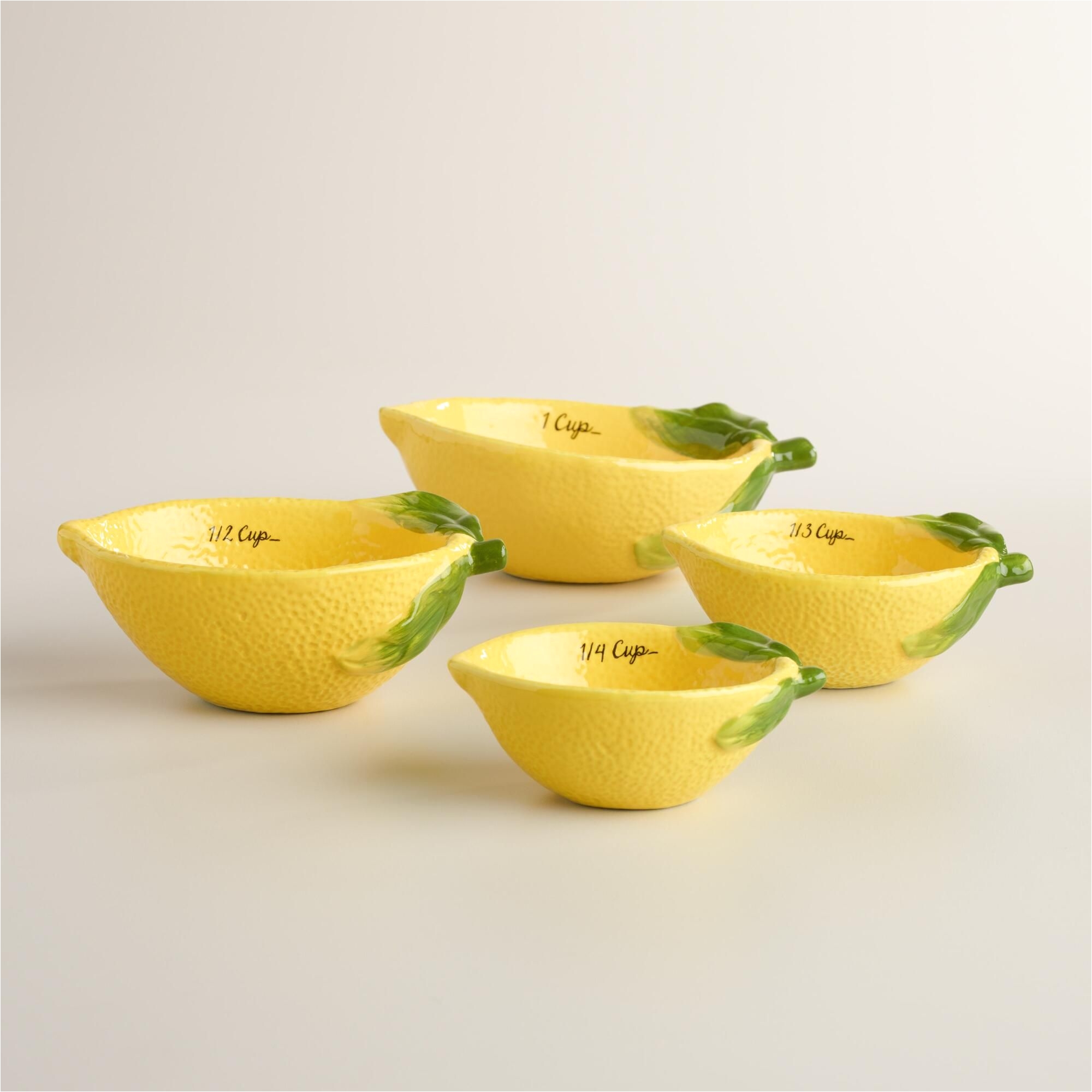 Decorative Ceramic Measuring Cups and Spoons Crafted Of Ceramic with A Fruit Like Texture Our Exclusive