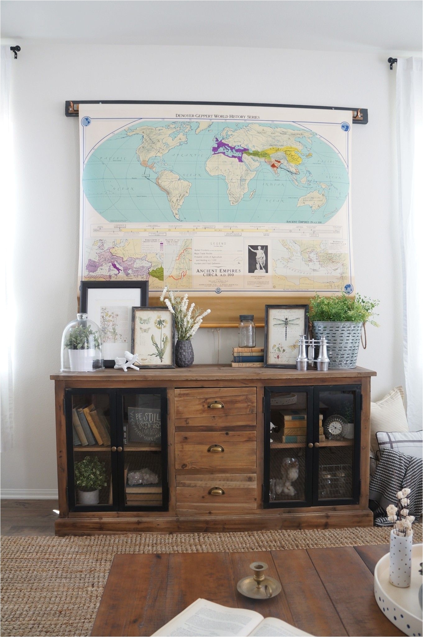 brilliant solution for disguising and hiding a tv a vintage pull down map featured on home love stories click through for more details and photos of