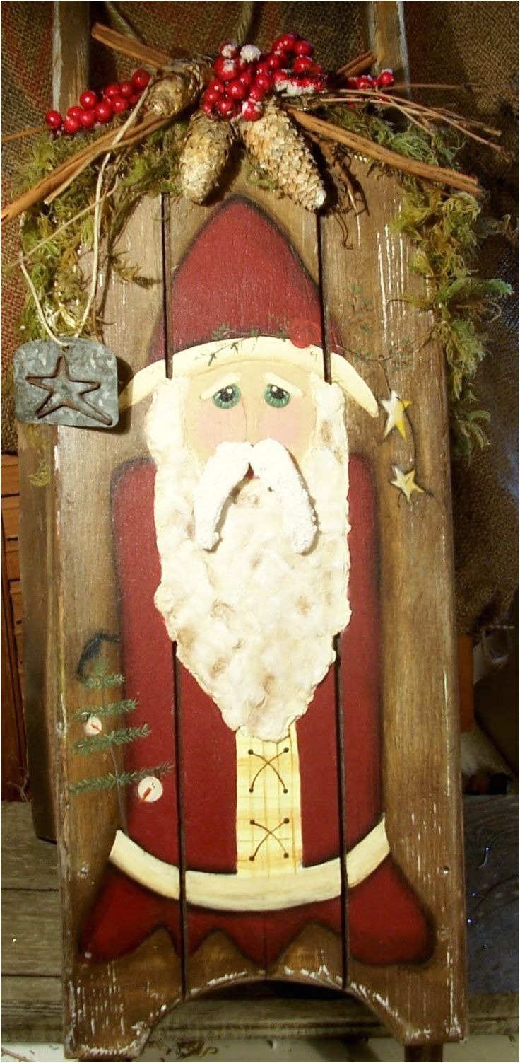 santa painted on old wood sled moustache and beard is made from paperclay