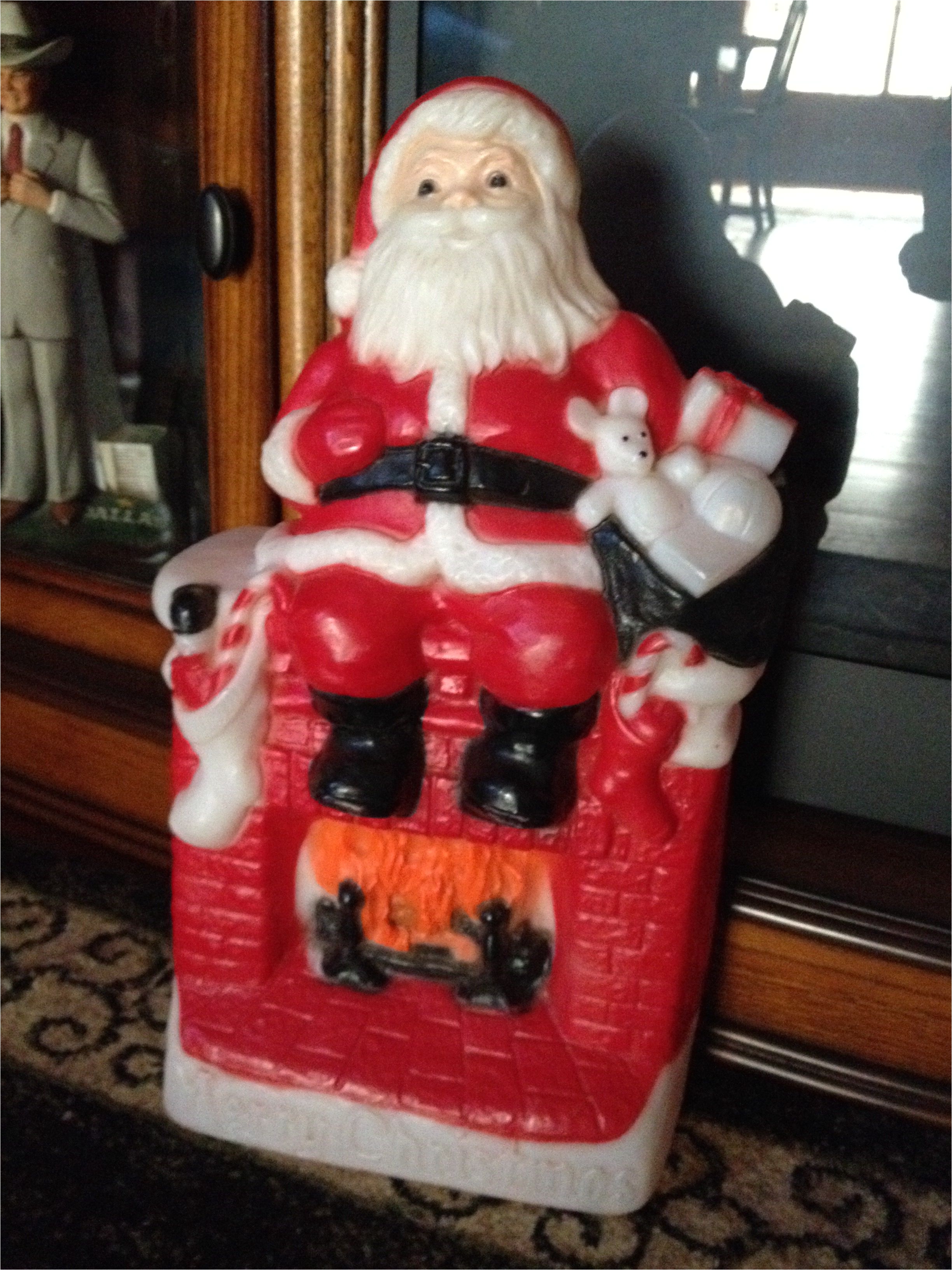 1981 santa setting on fireplace blow mold