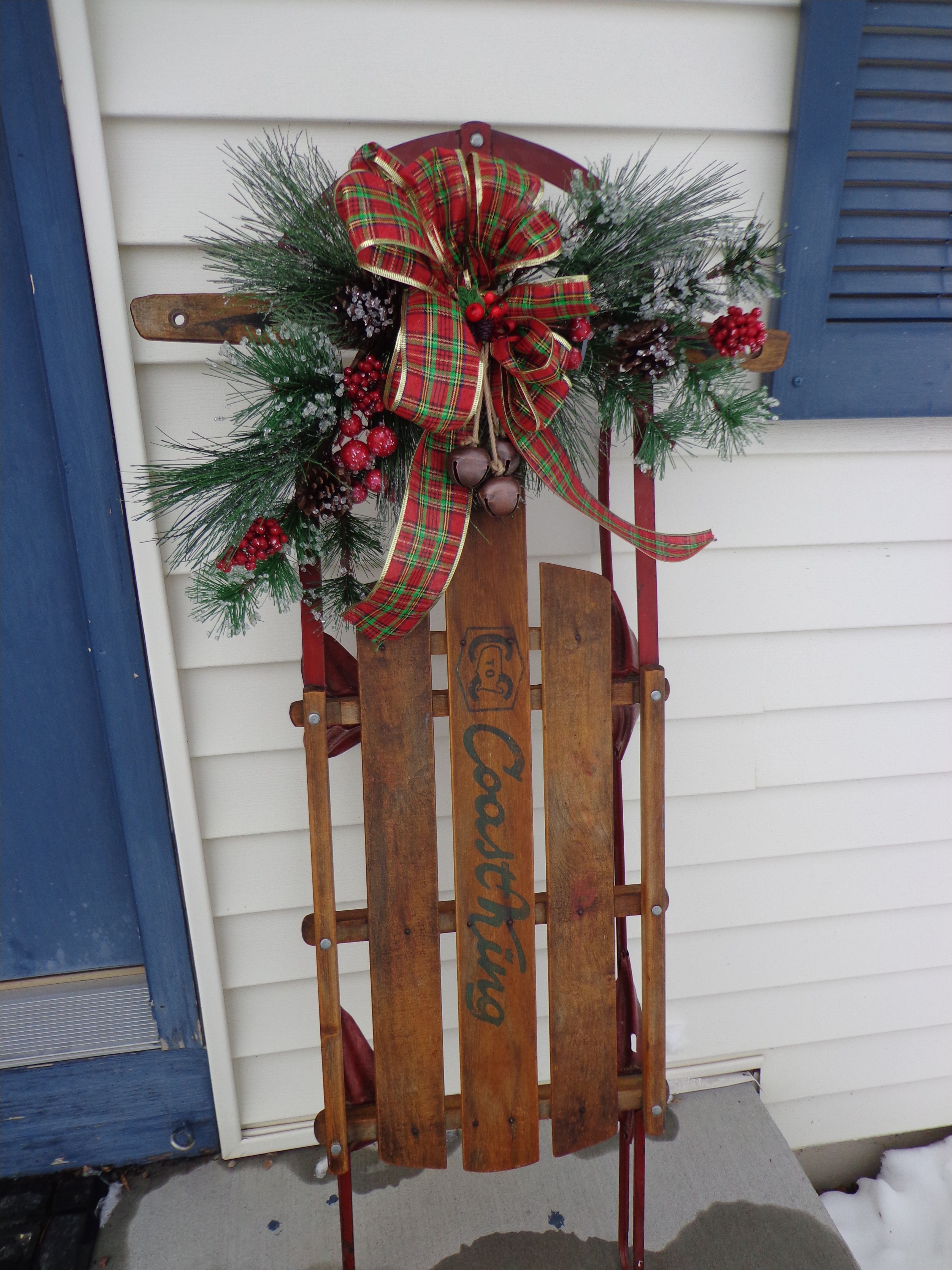 our childhood sled that my sister had the foresight to save she was gracious enough to let me repurpose it for a very special christmas decoration