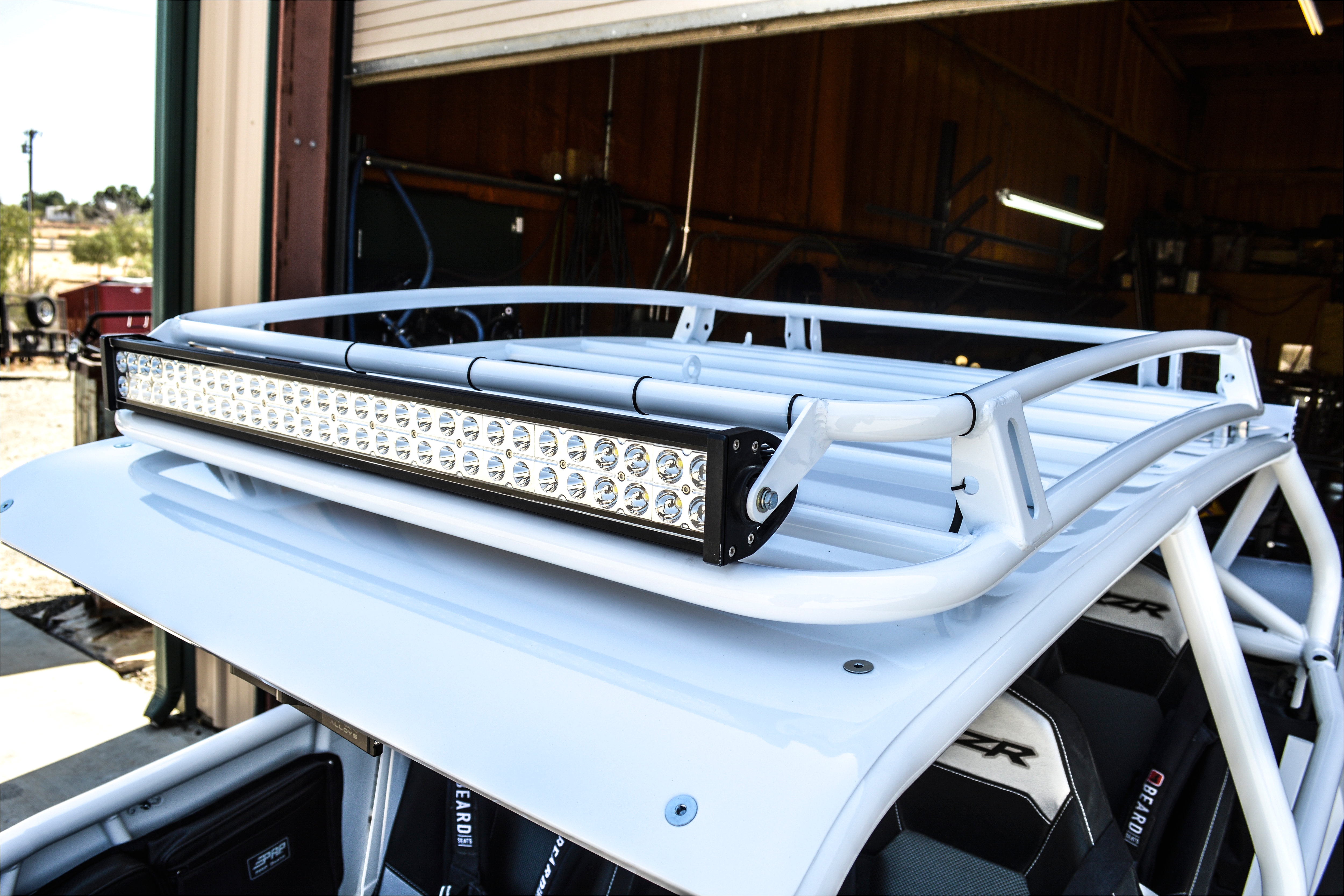 madigan motorsports roof rack for the polaris rzr xp 1000 4 seater fits 2014 up our roof rack features 1 25 and 1 seam welded tubing