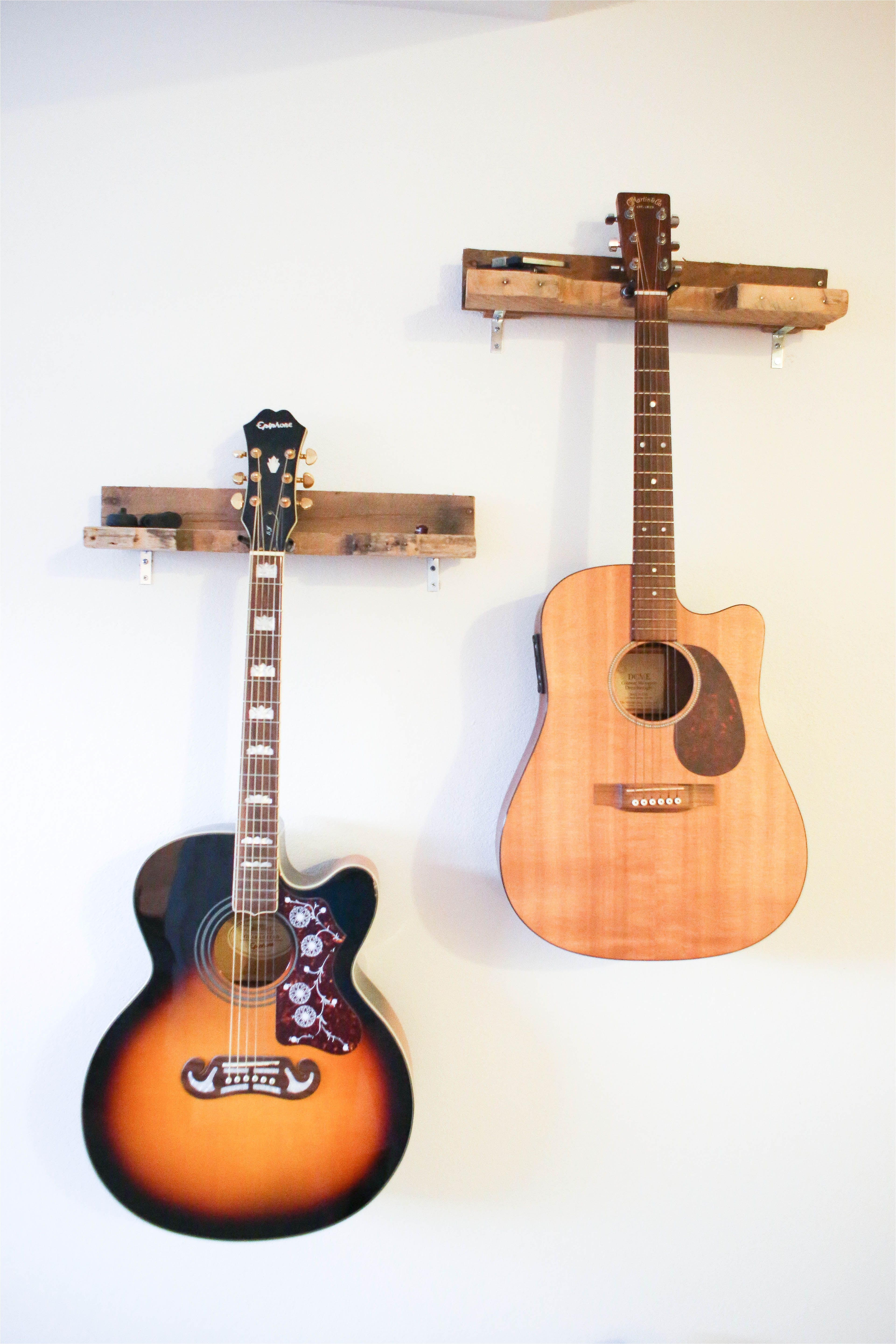 lovely handcrafted solid wood guitar rack made primarily out of old pallets the wood has been washed and sanded for heath and safety purposes