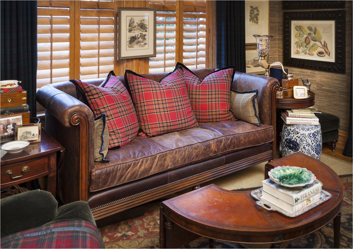 classic brown leather sofa settee with single seat cushion and tartan throw pillows nell hill