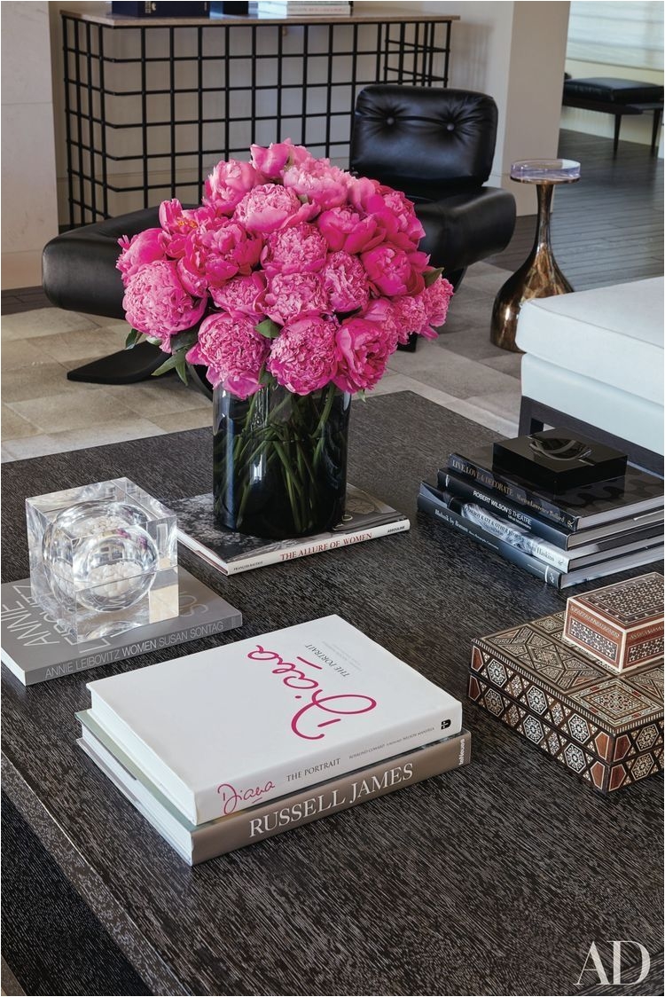 hot pink floral arrangement takes center stage on this coffee table arrangement