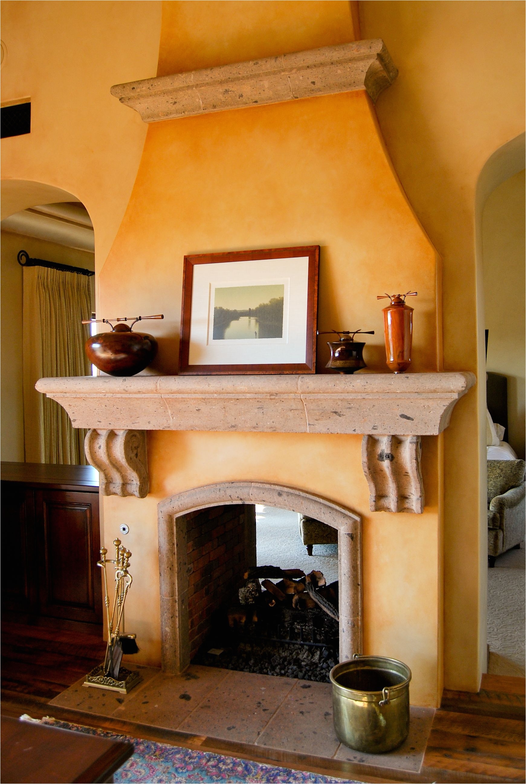 spanish style molding at top of fireplace