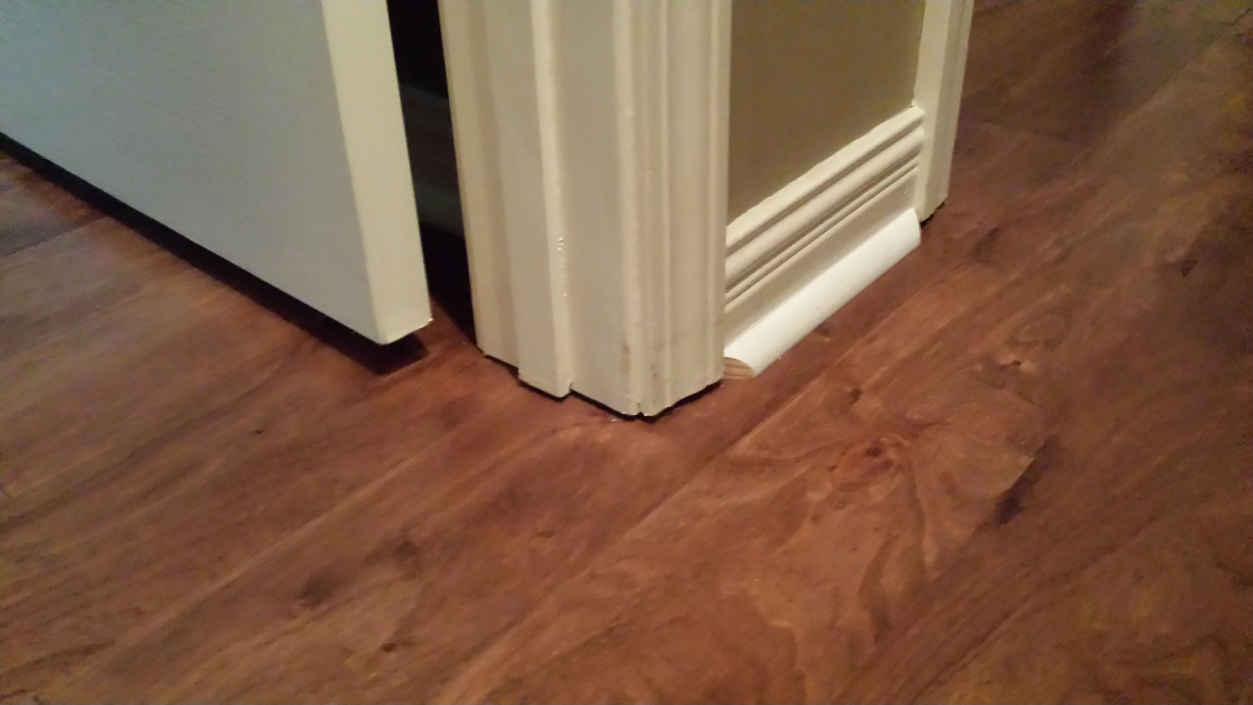 after we removed our carpet and installed our laminate floors it wasn long before we noticed the ugly gap under our door casing we had two choices