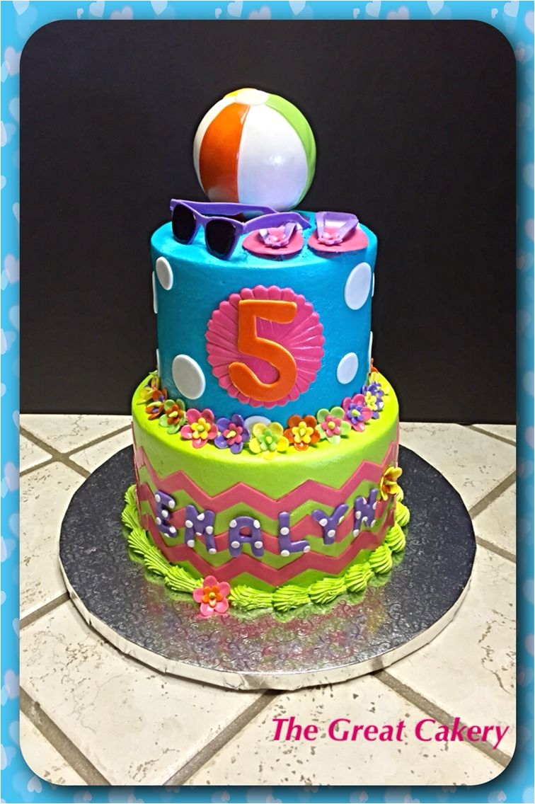 a beach themed tiered cake complete with sunglasses flip flops and a beach ball a