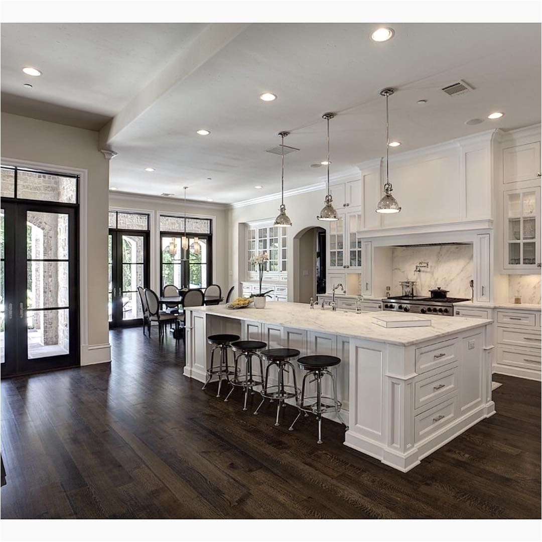 love the contrast of white and dark wood floors by simmons estate homes