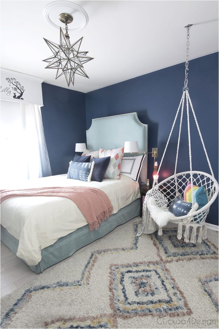 dark blue teenage girl room with turquoise velvet bed and macrame hanging chair