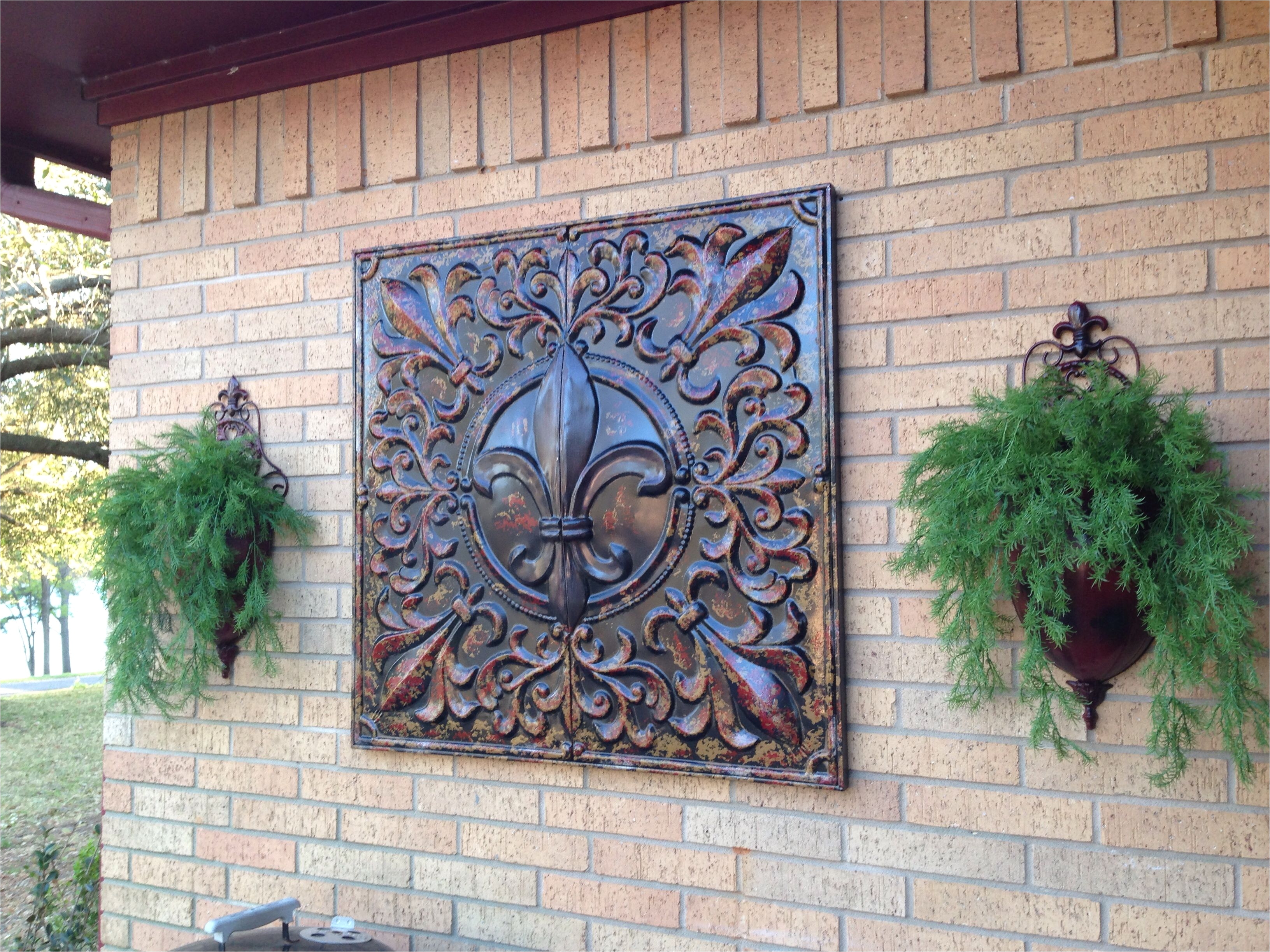 fleur d lis metal art bought hobby lobby for 50 off metal wall sconces found garden ridge i spray painted them to match