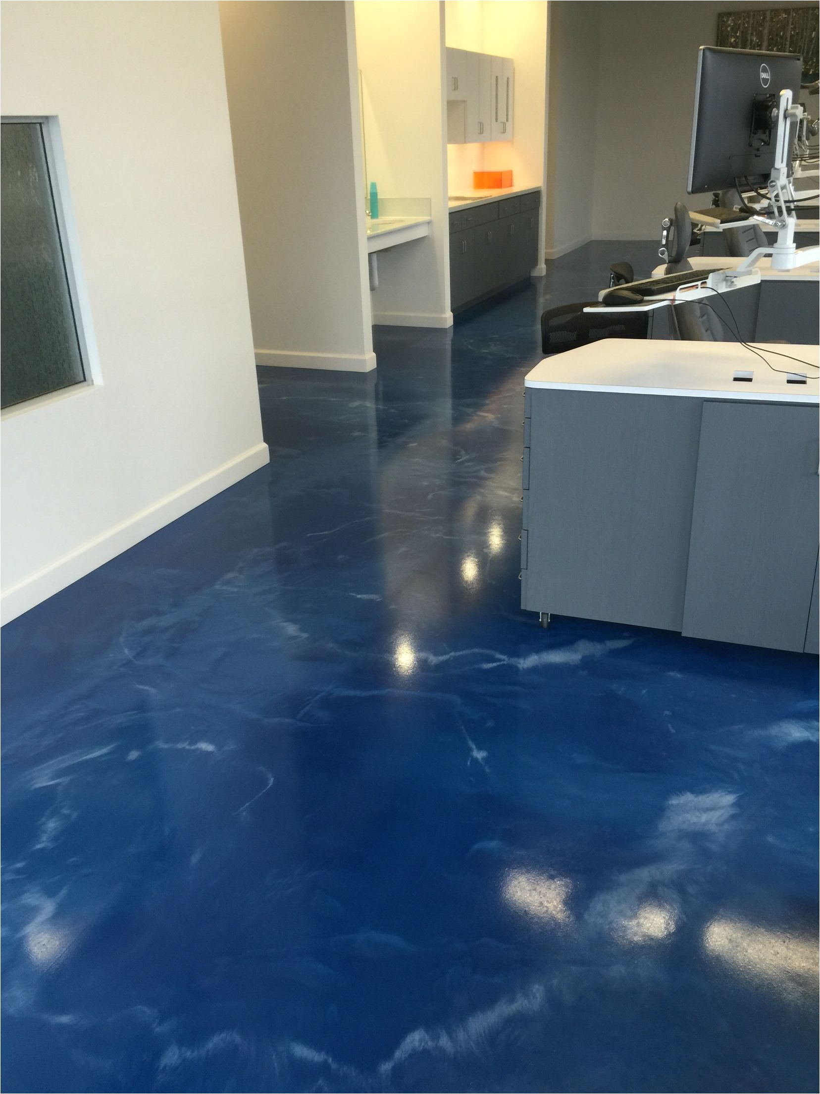 metallic epoxy floor installed for a dental office by sierra concrete arts