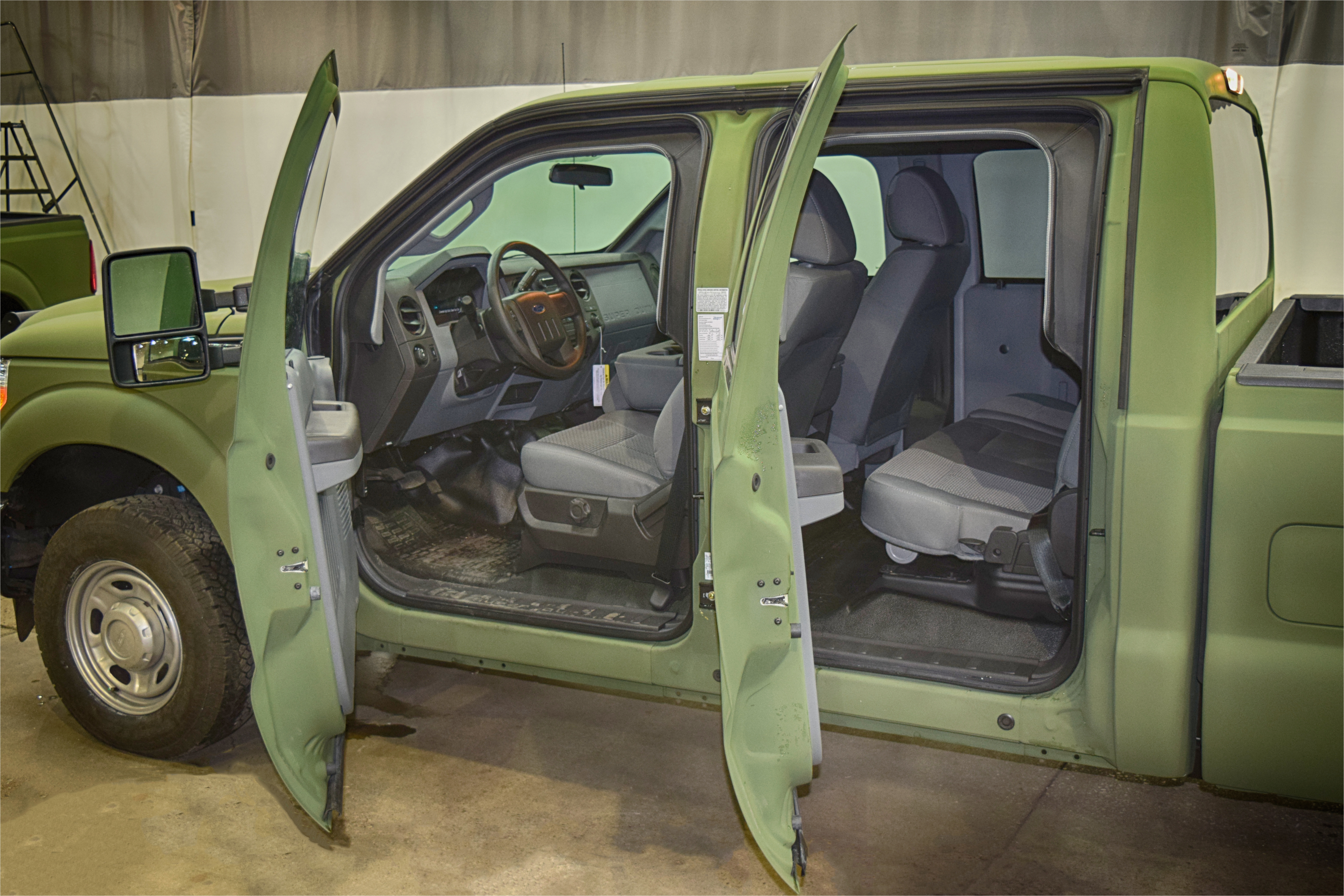 interior of green bulletproof ford f 350 truck