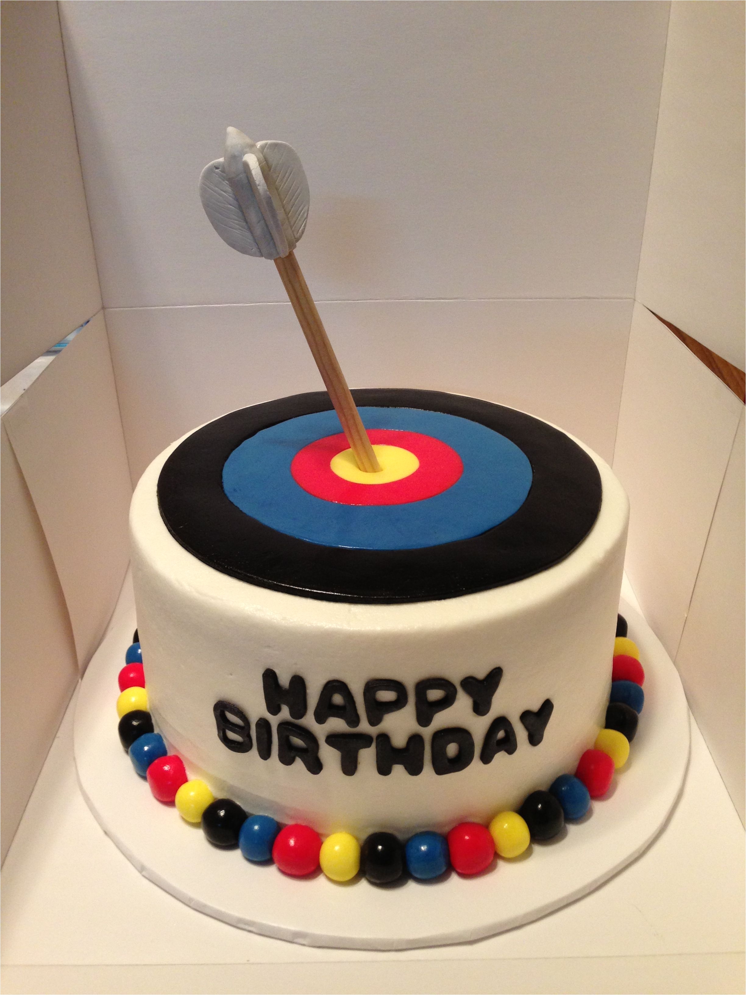 archery target cake fondant target tops an eight inch cake arrow made of wooden dowel with gumpaste feathers