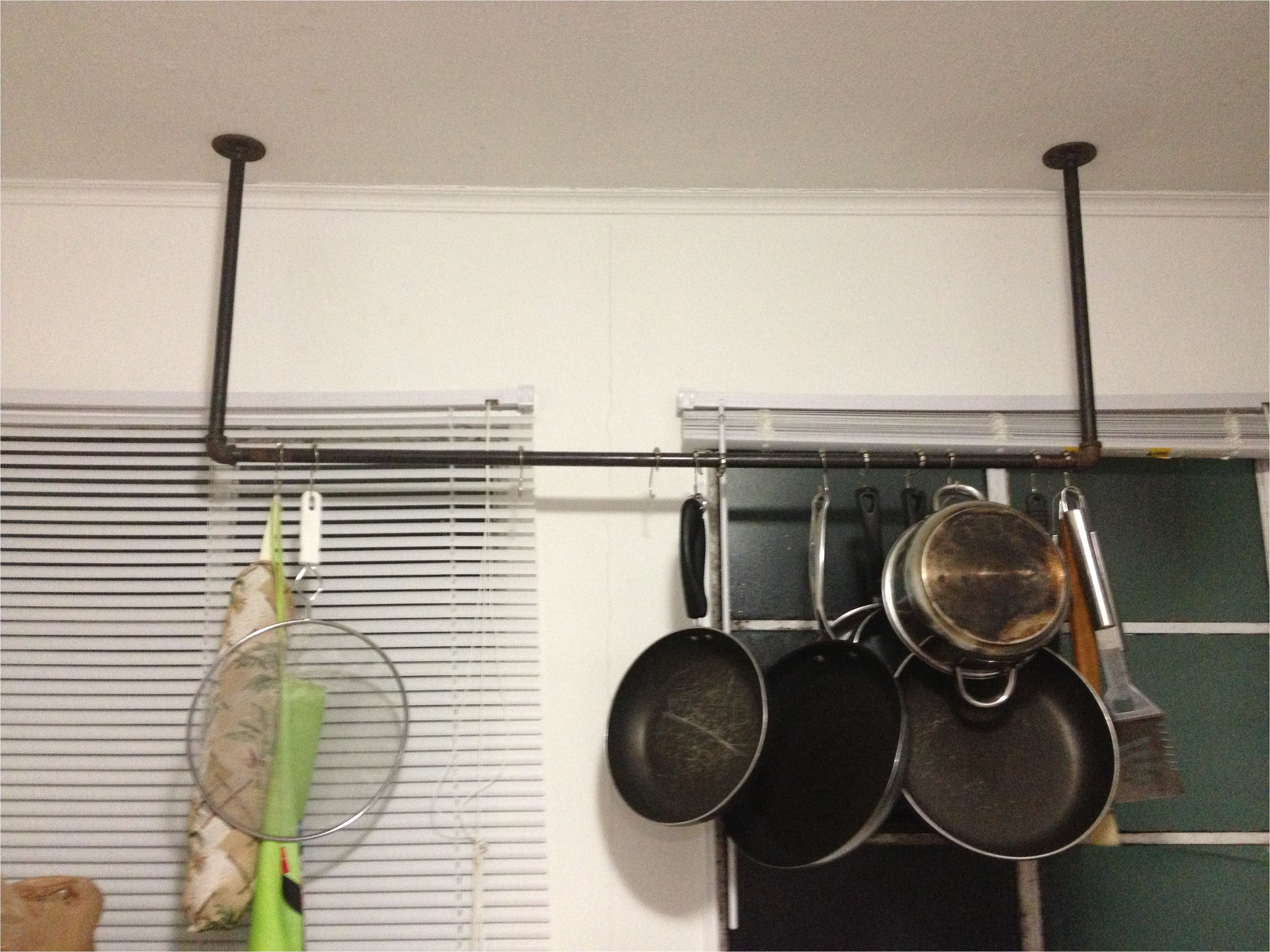 diy pot and pan rack so cheap and easy to make black iron pipe has threading for easy assembly you can find it at any hardware store to hang the pots i