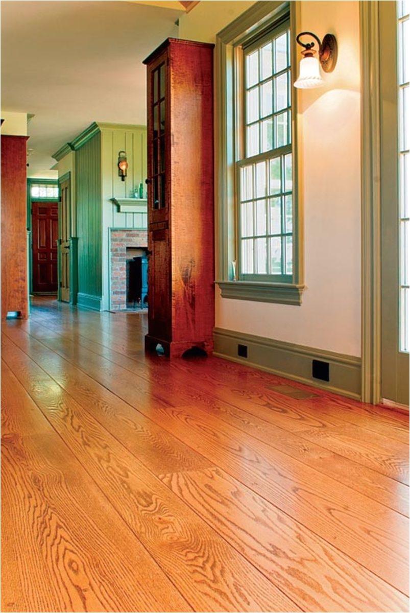 using wide plank flooring can help a new addition blend with an old house