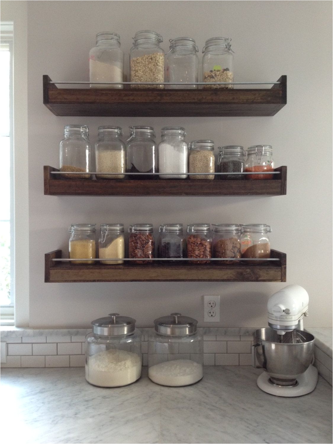drink center in kitchen with floating shelves