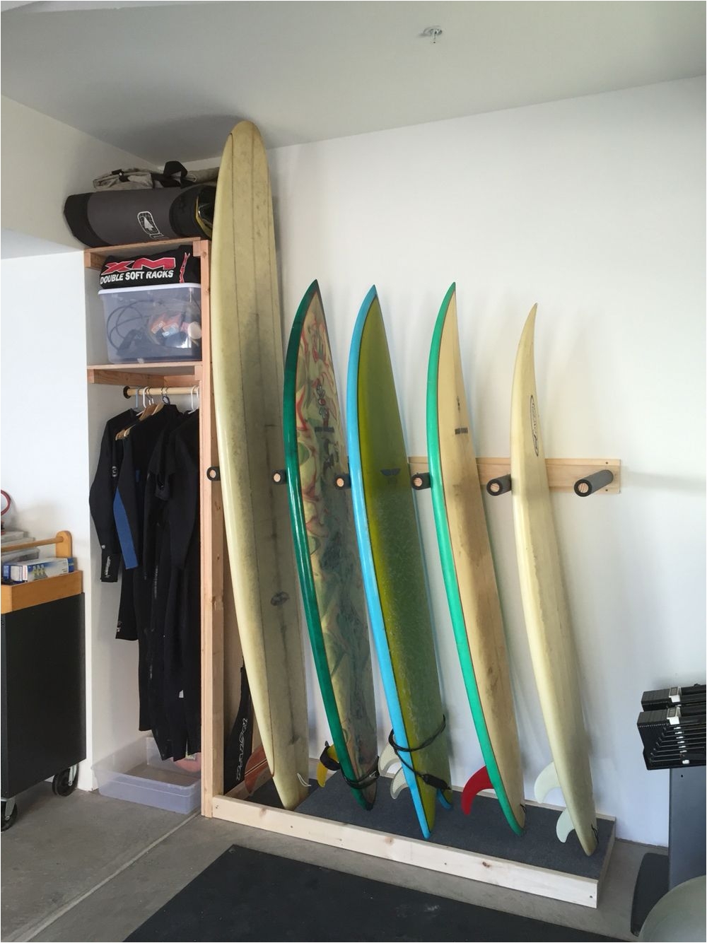 surf rack build with a shelf cubby for wetsuits accessories
