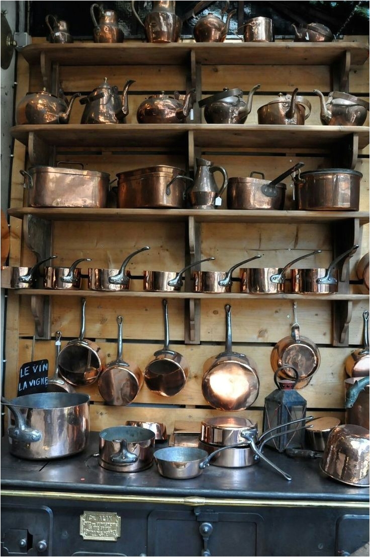 copper pots and pans a paris flea market this reminds me of the scene in julia and julie when julia child buys here copper pots