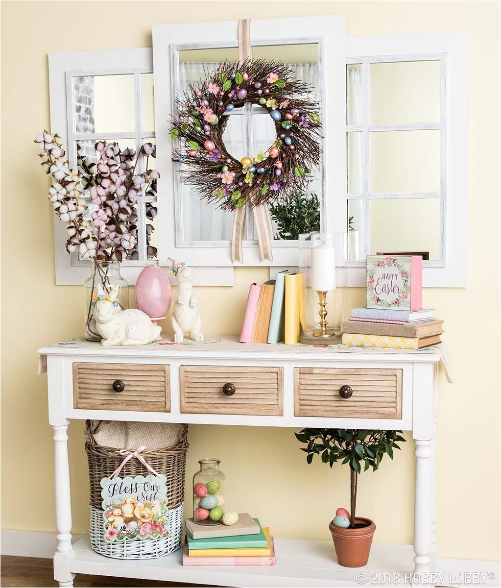 a beautiful easter entryway is easily achieved with pops of pastels and everyday decor