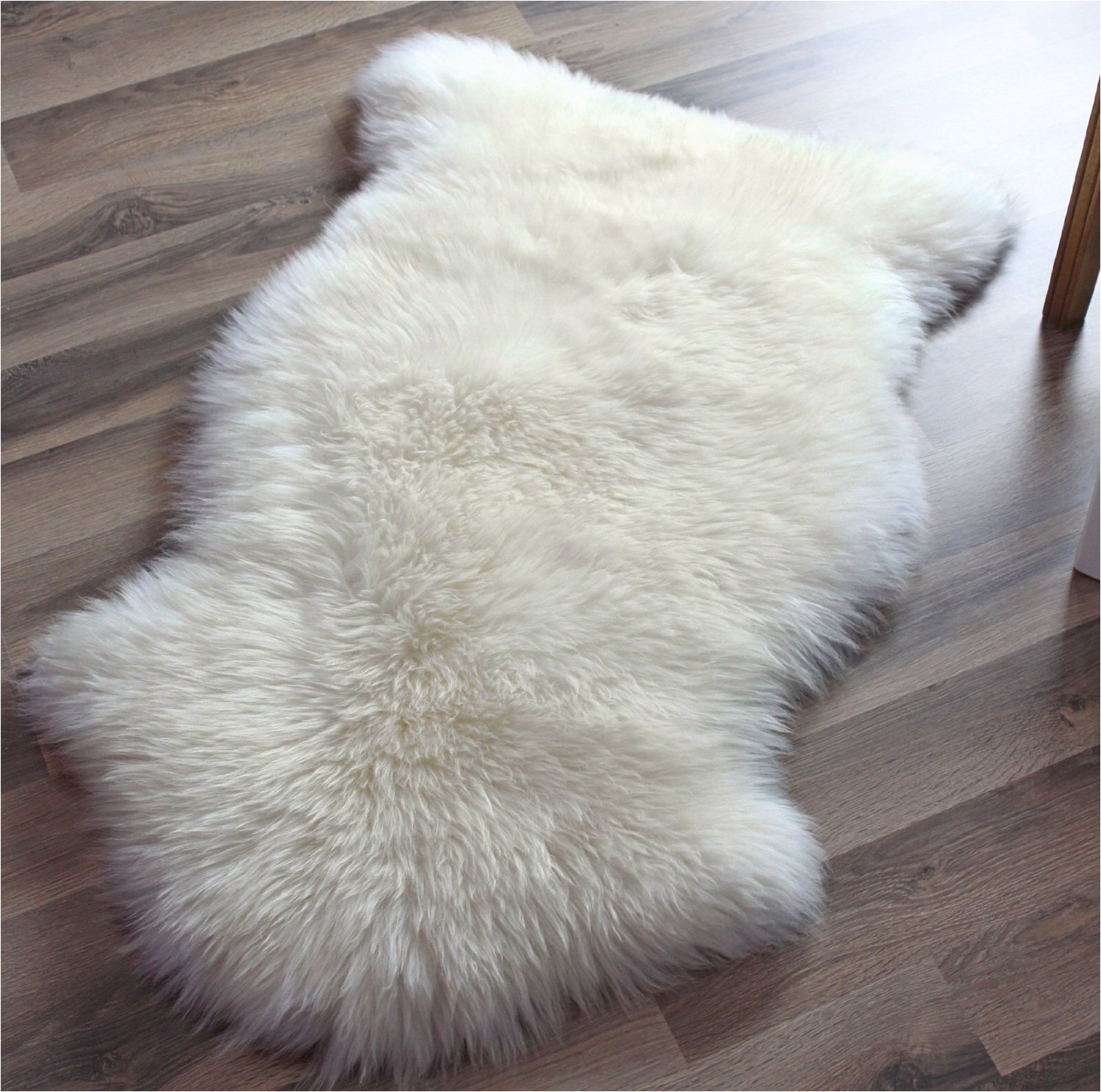 ivory faux sheepskin rug on wooden floor for pretty decoration ideas bear skin with head ikea area fur fake sheepski white decorating round accessories