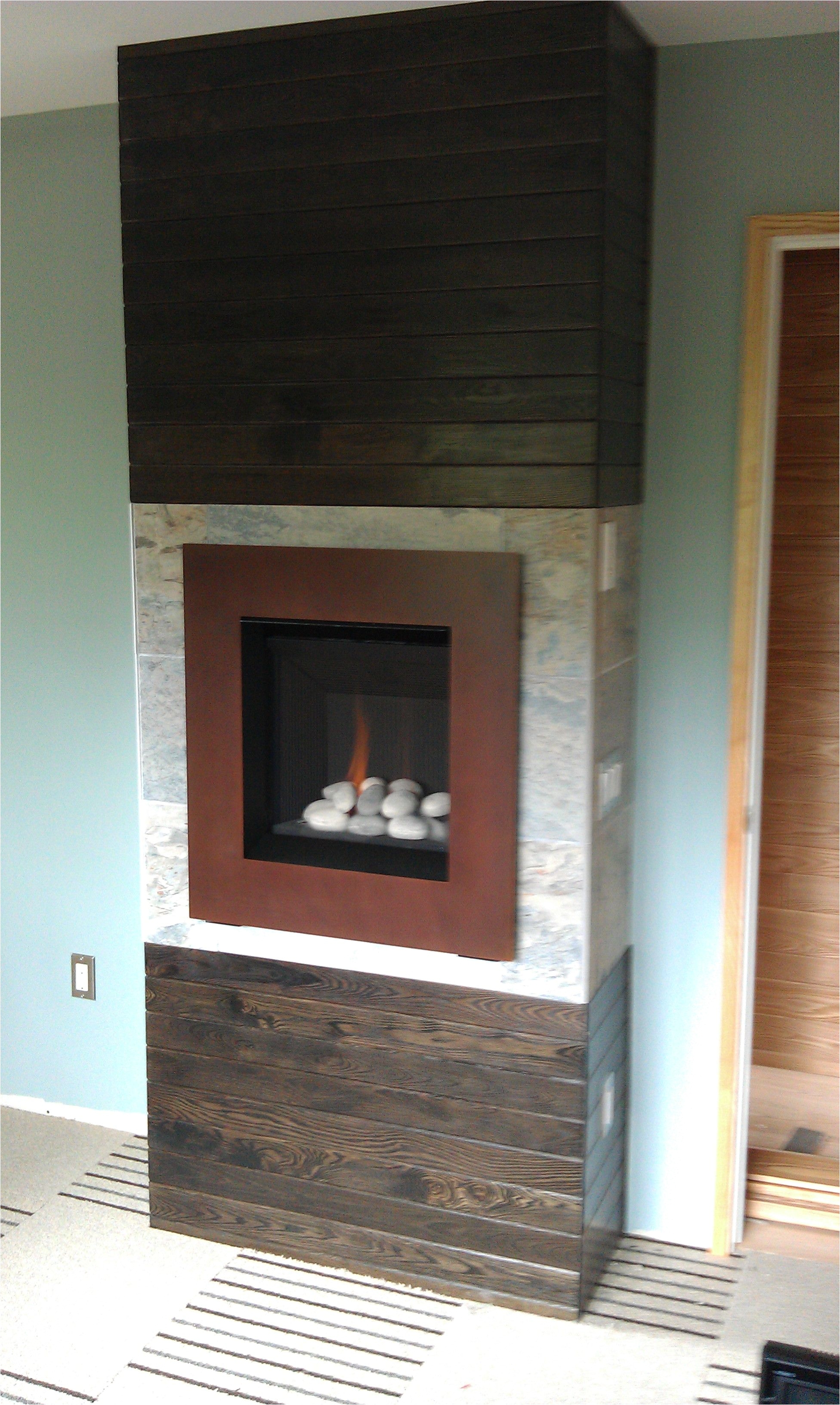 valor 530irn ledge stone fire radiant gas fireplace and insert installed with patina front in masonry fireplace in basement