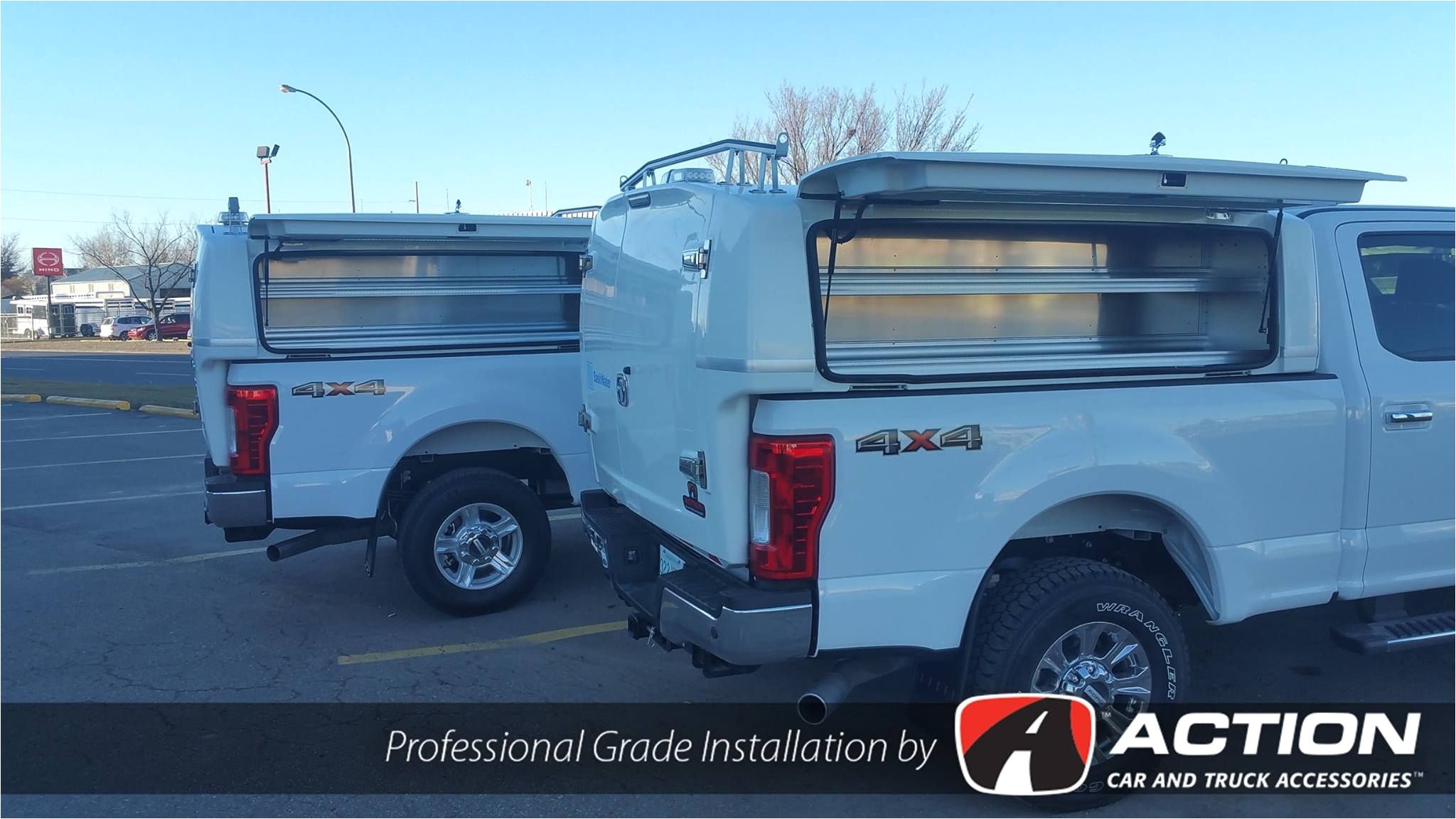 two fords upfitted with wild series spacekaps by spacekap shelving by ranger design bed slides by cargo ease installed by our store in regina sk
