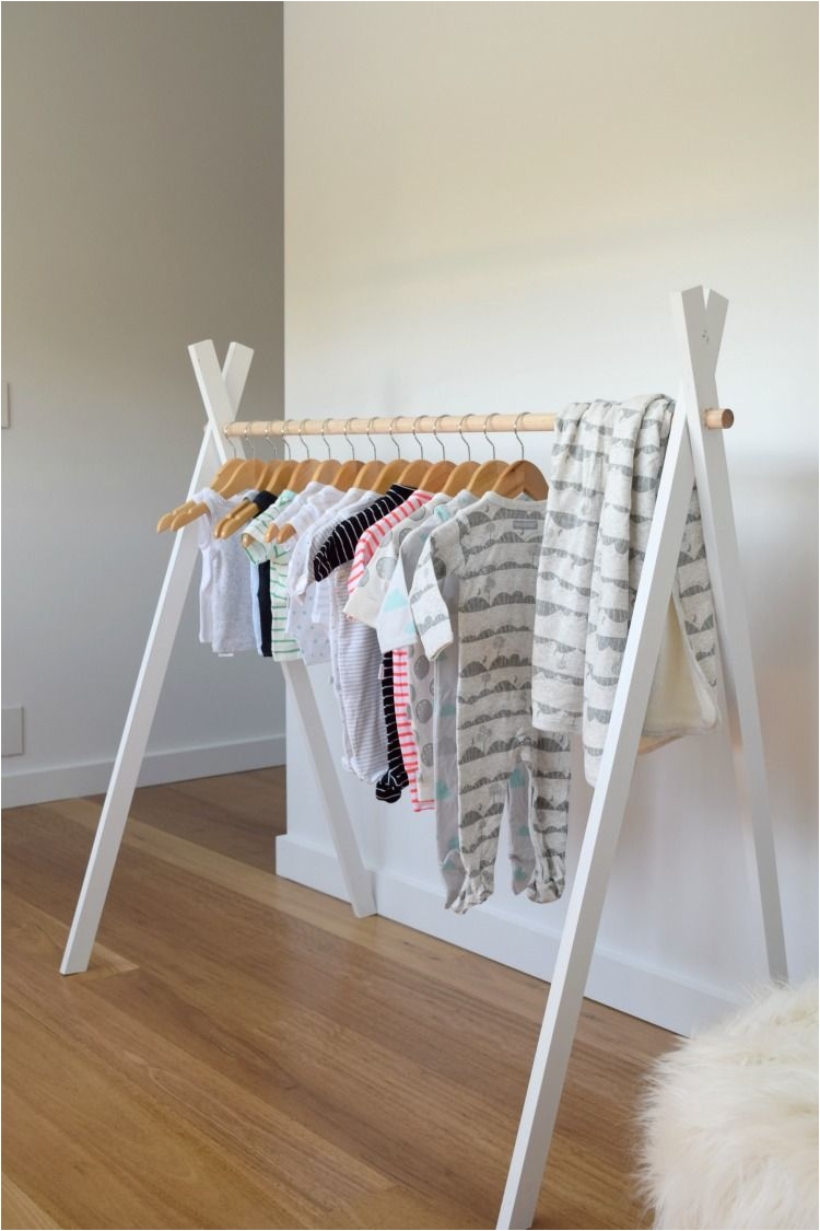 see how to make this adorable kids teepee rack with step by step instructions and photos perfect for displaying your fave kids clothes