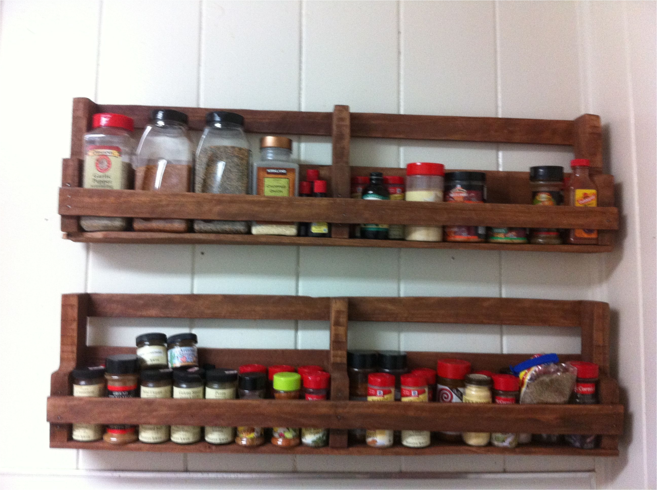 a home made spice rack made out of pallets