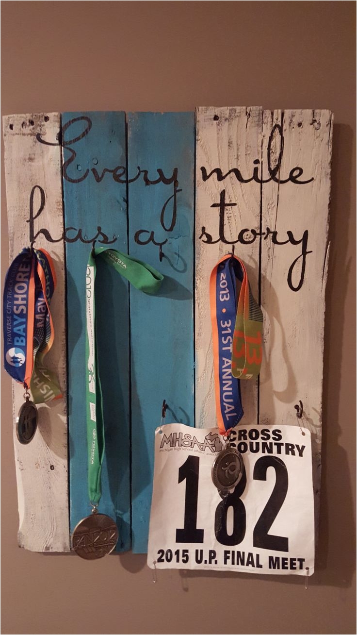 every mile has a story turquoise pallet wood medal display